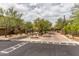 Gated community entrance with lush landscaping and brick pavers at 20100 N 78Th Pl # 3092, Scottsdale, AZ 85255