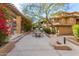 Outdoor patio area with table, chairs, grill, and blooming bougainvillea at 20100 N 78Th Pl # 3092, Scottsdale, AZ 85255