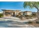 Single-story home with a brown garage door and desert landscaping at 20578 W Meadowbrook Ave, Buckeye, AZ 85396