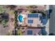 Aerial view of a home with solar panels, pool, and a fenced backyard at 2417 W Apache Rain Rd, Phoenix, AZ 85085