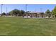 Park with grassy field, covered picnic area, and playground at 2615 E Santa Ynez Dr, Casa Grande, AZ 85194