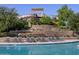 Community pool with a waterslide and ample lounge chairs at 2635 E Santa Ynez Dr, Casa Grande, AZ 85194