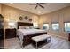 Bright and spacious main bedroom with a large bed and plenty of natural light at 26392 W Abraham Ln, Buckeye, AZ 85396