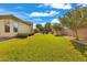 Spacious backyard featuring a lush green lawn and landscaped borders at 2879 E Portola Valley Ct, Gilbert, AZ 85297