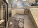 Backyard with paved patio, small grassy area, and surrounding walls for privacy at 3228 W Glendale Ave # 118, Phoenix, AZ 85051
