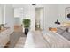 Bedroom with carpeted floors, ensuite bathroom, and additional room access at 3228 W Glendale Ave # 118, Phoenix, AZ 85051
