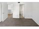 Bedroom featuring carpet flooring, an ensuite bathroom, and a doorway to another room at 3228 W Glendale Ave # 118, Phoenix, AZ 85051