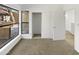 Bright bedroom with large window, closet, and carpeted floors at 3228 W Glendale Ave # 118, Phoenix, AZ 85051