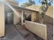 Front yard of a two-story home with a walkway, landscaping, and a tree at 3228 W Glendale Ave # 118, Phoenix, AZ 85051