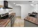 Modern kitchen with stainless steel appliances and wood countertops at 3228 W Glendale Ave # 118, Phoenix, AZ 85051