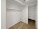 Laundry room with built-in shelving and tile flooring at 3228 W Glendale Ave # 118, Phoenix, AZ 85051