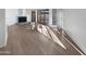 Spacious living room with wood-look flooring, a fireplace, and ample natural light at 3228 W Glendale Ave # 118, Phoenix, AZ 85051
