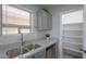 Modern kitchen featuring stainless steel appliances, granite countertops, and ample cabinet space at 40092 W Hayden Dr, Maricopa, AZ 85138