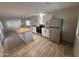 Kitchen with island, stainless steel appliances, and white cabinets at 4065 E University Dr # 334, Mesa, AZ 85205