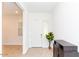 Bright foyer with white walls, light wood-look flooring, and an entryway table at 4222 W Carmen St, Laveen, AZ 85339