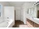Spacious bathroom featuring double sinks, a soaking tub, and ample counter space at 4481 E Sundance Ct, Gilbert, AZ 85297