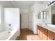 Spacious bathroom with double vanity, soaking tub, and tile flooring at 4481 E Sundance Ct, Gilbert, AZ 85297