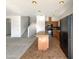 Kitchen with an island, black appliances, and tiled floors at 4481 E Sundance Ct, Gilbert, AZ 85297