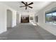 Open-concept living room leading to the kitchen and backyard access at 4481 E Sundance Ct, Gilbert, AZ 85297