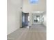 Spacious living room with high ceilings, large windows, and plush carpeting at 4481 E Sundance Ct, Gilbert, AZ 85297