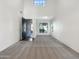 Spacious living room with high ceilings, large windows, and plush carpeting at 4481 E Sundance Ct, Gilbert, AZ 85297