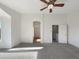Large main bedroom with carpeted floors, white walls, and an ensuite bathroom entrance at 4481 E Sundance Ct, Gilbert, AZ 85297