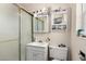 A bathroom with a shower, sink, toilet, medicine cabinet, and other personal care items at 453 S Miller St, Mesa, AZ 85204