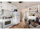 Kitchen featuring white appliances, ample storage, and a dining area at 453 S Miller St, Mesa, AZ 85204