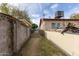 Side yard with a gate and block wall at 453 S Miller St, Mesa, AZ 85204