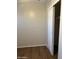 Bedroom with wood-look floors and a spacious closet at 4921 W Glenrosa Ave, Phoenix, AZ 85031