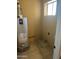 Laundry room with water heater and space for washer/dryer at 4921 W Glenrosa Ave, Phoenix, AZ 85031