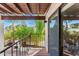 Balcony overlooking trees and community area, offering outdoor living space at 7385 E Pleasant Run, Scottsdale, AZ 85258