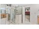 Bathroom with large walk-in shower, tile flooring, and dual sinks at 7385 E Pleasant Run, Scottsdale, AZ 85258