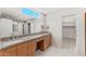 Modern bathroom featuring dual sink vanity and a large walk-in closet at 7385 E Pleasant Run, Scottsdale, AZ 85258