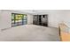 Bedroom or office space with built-in shelves, sliding glass door to balcony, and ceiling fan at 7385 E Pleasant Run, Scottsdale, AZ 85258