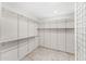 Walk-in closet with ample storage space including clothes racks and shelves at 7385 E Pleasant Run, Scottsdale, AZ 85258