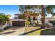 Inviting two-story home with attached garage, balcony, and landscaped front yard at 7385 E Pleasant Run, Scottsdale, AZ 85258