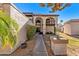 Front yard with walkway, landscaping, and inviting entryway at 7385 E Pleasant Run, Scottsdale, AZ 85258