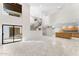 Open living area with tiled floors, high ceilings, and sliding glass doors at 7385 E Pleasant Run, Scottsdale, AZ 85258