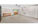 Spacious loft with built-in cabinets, carpeted floors, and a ceiling fan at 7385 E Pleasant Run, Scottsdale, AZ 85258