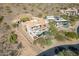 An aerial view of the home and surrounding desert landscape at 11328 E Dreyfus Ave, Scottsdale, AZ 85259