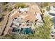 View of a luxury home with clay tile roof, balconies, pool, and spa at 11328 E Dreyfus Ave, Scottsdale, AZ 85259