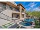 Luxury backyard with pool, spa, and seating area at 11328 E Dreyfus Ave, Scottsdale, AZ 85259