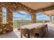 Large outdoor dining table on a scenic balcony at 11328 E Dreyfus Ave, Scottsdale, AZ 85259