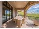 Outdoor dining area on a balcony with desert views at 11328 E Dreyfus Ave, Scottsdale, AZ 85259