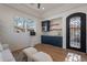 Bonus room with wet bar, blue cabinets, and wood-look floors at 11328 E Dreyfus Ave, Scottsdale, AZ 85259