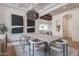 Formal dining space with modern art, coffered ceiling, and view into living area at 11328 E Dreyfus Ave, Scottsdale, AZ 85259