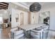 Dining room featuring a large table, modern chandelier, and stylish chairs at 11328 E Dreyfus Ave, Scottsdale, AZ 85259