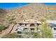 Backyard of a luxury home with a pool, patio furniture, and a view of the mountainside at 11328 E Dreyfus Ave, Scottsdale, AZ 85259