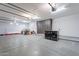 Spacious garage with storage cabinets and a laundry area at 11328 E Dreyfus Ave, Scottsdale, AZ 85259